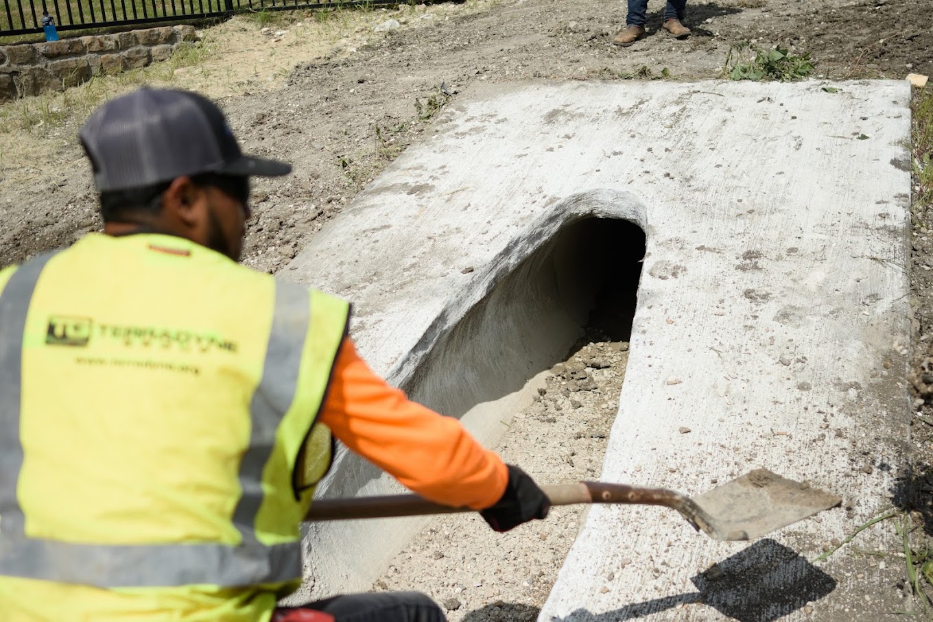 Outfall Controls. worker working on preventing Outfall Controls